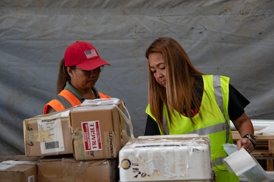 DLA Distribution workers processing material.