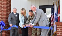 U.S. Army Space and Missile Defense Command's Richard P. De Fatta, deputy to the commander; Nicole Olbricht, Technical Center Systems Integration Division chief; Lt. Gen. Daniel L. Karbler, commanding general; and Michael Krause, Technical Center acting director, cut the ribbon at the dedication ceremony for the opening of the Air and Missile Systems Integration Lab on Aug. 8 at Redstone Arsenal, Alabama. SMDC also dedicated the Directed Energy Systems Integration Lab as part of SMDC Technical Center’s Technology Complex earlier in the day. (U.S. Army photo by Ronald Bailey)