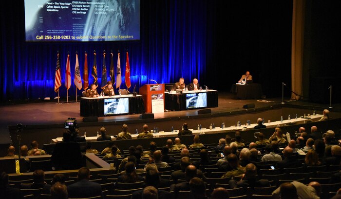 Lt. Gen. Daniel L. Karbler, commanding general of U.S. Army Space and Missile Defense Command; Lt. Gen. Maria B. Barrett, commanding general of U.S. Army Cyber Command; and Lt. Gen. Jonathan P. Braga, commanding general of U.S. Army Special Operations Command participate in a space, cyber and special operations “Influence Triad” panel at the 25th annual Space and Missile Defense Symposium at the Von Braun Center in Huntsville, Alabama, on Aug. 9. As an emerging joint concept, this “Influence Triad” will provide integrated deterrence and active campaigning options in competition, crisis, and conflict through synchronization of mutually supporting domain capabilities to shape the operational environment or create effects in support of strategic objectives. In this triad, special operations provides cyber access; cyber sets the conditions for special operations; and space effects enable both cyber and special operations or any combination thereof. (U.S. Army photo by Carrie David Campbell)