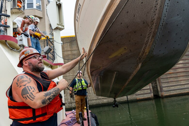 Crewmembers with the U.S. Army Corps of Engineers Medium Capacity Fleet perform repairs at the New Cumberland Locks and Dam on the Ohio River in Moraine, Ohio.