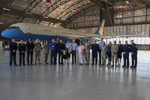 A group of Joint Base Andrews leadership, honorary commanders and members of the 89th Airlift Wing pose for a photo in front of a Boeing C-32 during an honorary commanders immersion event at Joint Base Andrews, Md., Aug. 16, 2022. The immersion event was intended to continue maintaining strong relationships with leaders in the local community and highlight the mission of the 89th Airlift Wing. (U.S. Air Force photo by Airman 1st Class Isabelle Churchill)