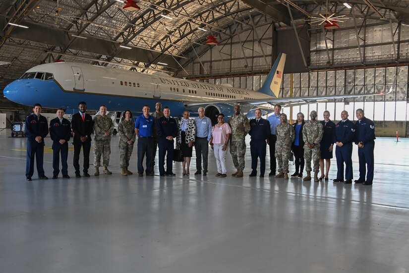 A group of Joint Base Andrews leadership, honorary commanders and members of the 89th Airlift Wing pose for a photo in front of a Boeing C-32 during an honorary commanders immersion event at Joint Base Andrews, Md., Aug. 16, 2022. The immersion event was intended to continue maintaining strong relationships with leaders in the local community and highlight the mission of the 89th Airlift Wing. (U.S. Air Force photo by Airman 1st Class Isabelle Churchill)
