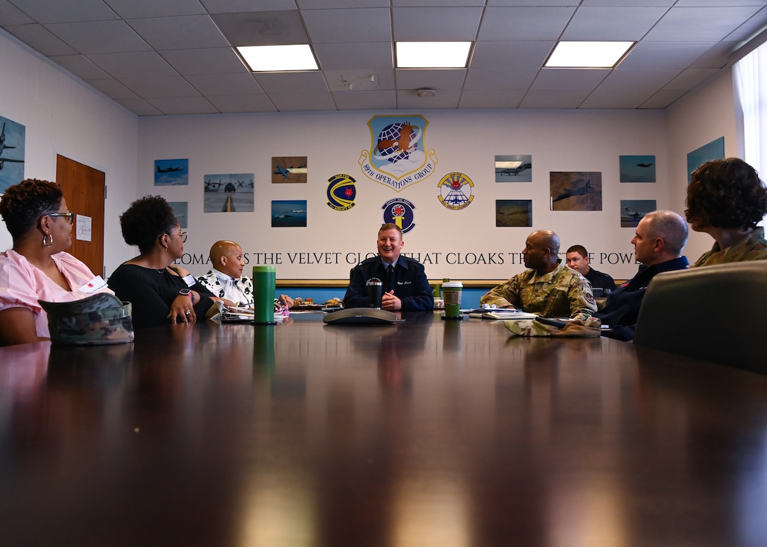 Col. Matthew Jones, 89th Airlift Wing commander, leads a mission brief for Joint Base Andrews leadership and honorary commanders during an immersion event at Joint Base Andrews, Md., Aug. 16, 2022. The honorary commanders immersion event began with a detailed presentation about the 89th Airlift Wing and was followed by a tour of the airfield, to include the inside of a Boeing C-32 and Boeing C-37. (U.S. Air Force photo by Airman 1st Class Isabelle Churchill)