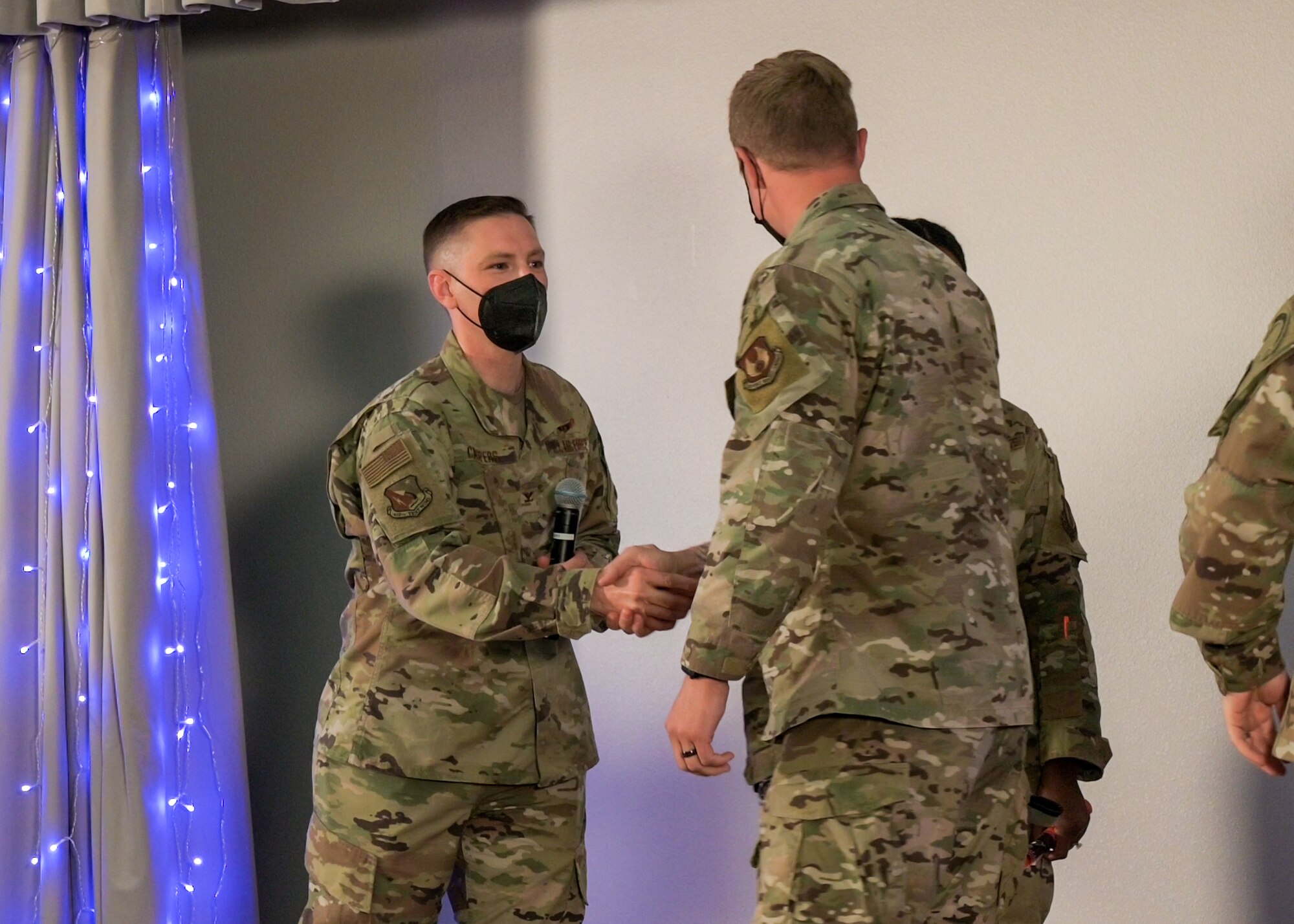 Col. Matthew Caspers, 412th Test Wing Vice Commander, congratulates Tech. Sgt. Robert Gregory, 412th Operations Support Squadron, Test Parachute Team, after winning Sticky's 412 TW Spark Tank innovation showcase, Aug. 3. (Air Force video by Giancarlo Casem)