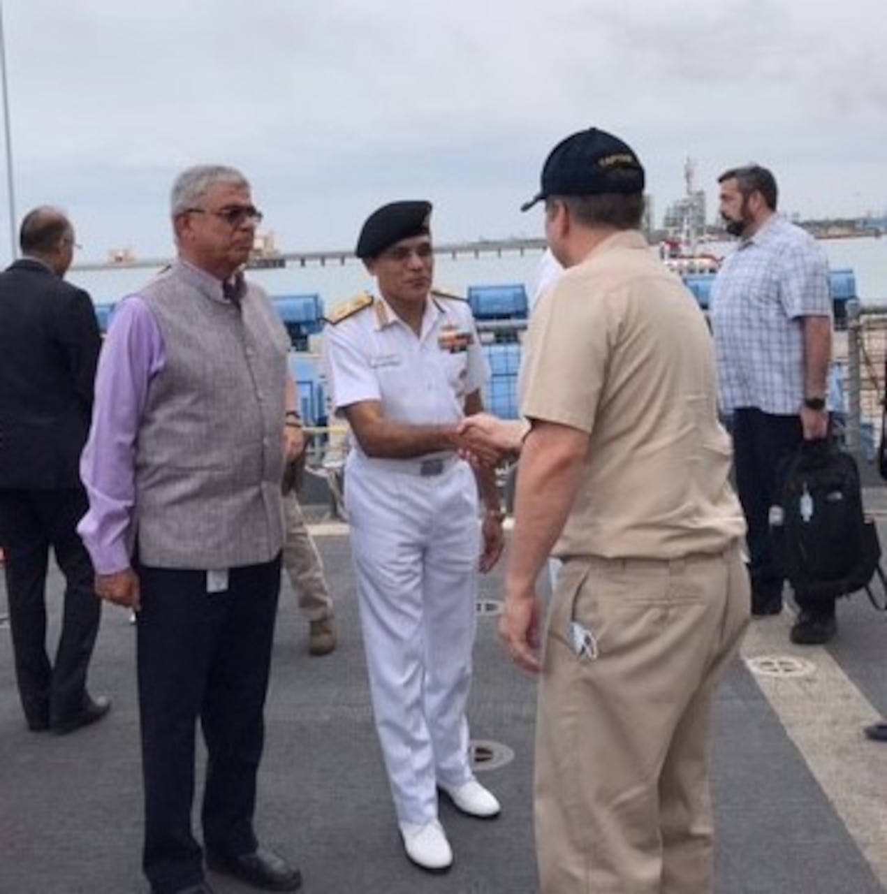 CHENNAI, INDIA (Aug. 7, 2022) – From left, L&T Shipbuilding Head, Shipyard and Program Management, P.R. Raghunath and India’s Vice Chief of Naval Staff Vice Admiral S.N. Ghormade meet Capt. William Hartman, master of the Lewis and Clark-class dry cargo ship USNS Charles Drew (T-AKE-10), at L&T Shipyard in Kattupalli, near Chennai, India, Aug. 7, 2022 where the ship will conduct scheduled maintenance. As part of Military Sealift Command’s Combat Logistics Force (CLF), Charles Drew enables U.S. Navy ships to remain at sea and combat ready for extended periods of time.  In addition, CLF ships, like Charles Drew, also resupply international partners and allies operating in the Indo-Pacific Region.  Under Commander, U.S. Pacific Fleet, 7th Fleet is the U.S. Navy's largest forward-deployed numbered fleet and routinely interacts and operates with 35 maritime nations in preserving a free and open Indo-Pacific Region. (Photo by Joel Garcia)