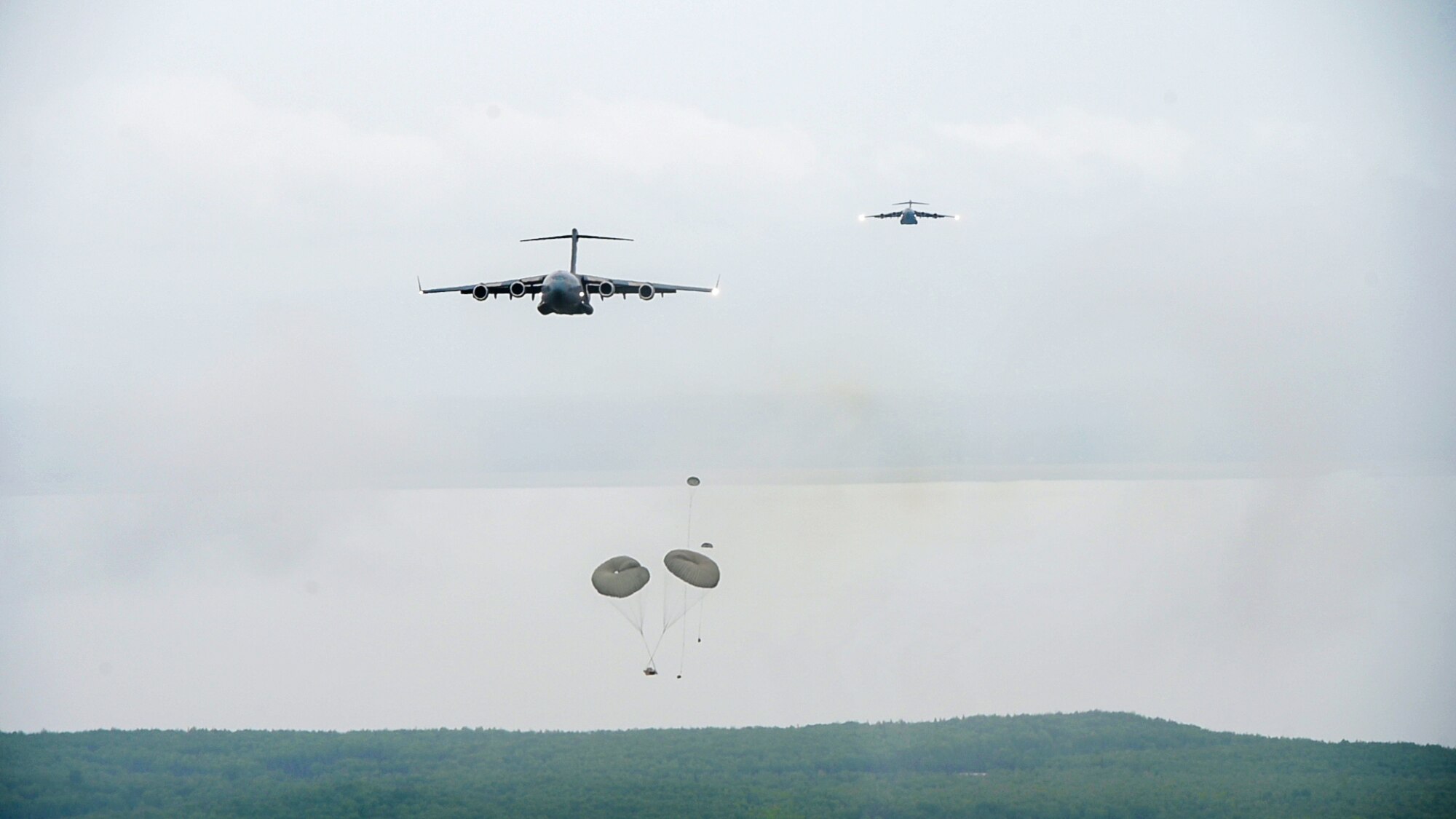 U.S. Air Force C-17 Globemaster III's from the 204th, 144th, and 517th Airlift Squadrons executed airdrop training July 7, 2022, Joint Base Elmendorf-Richardson, Alaska.