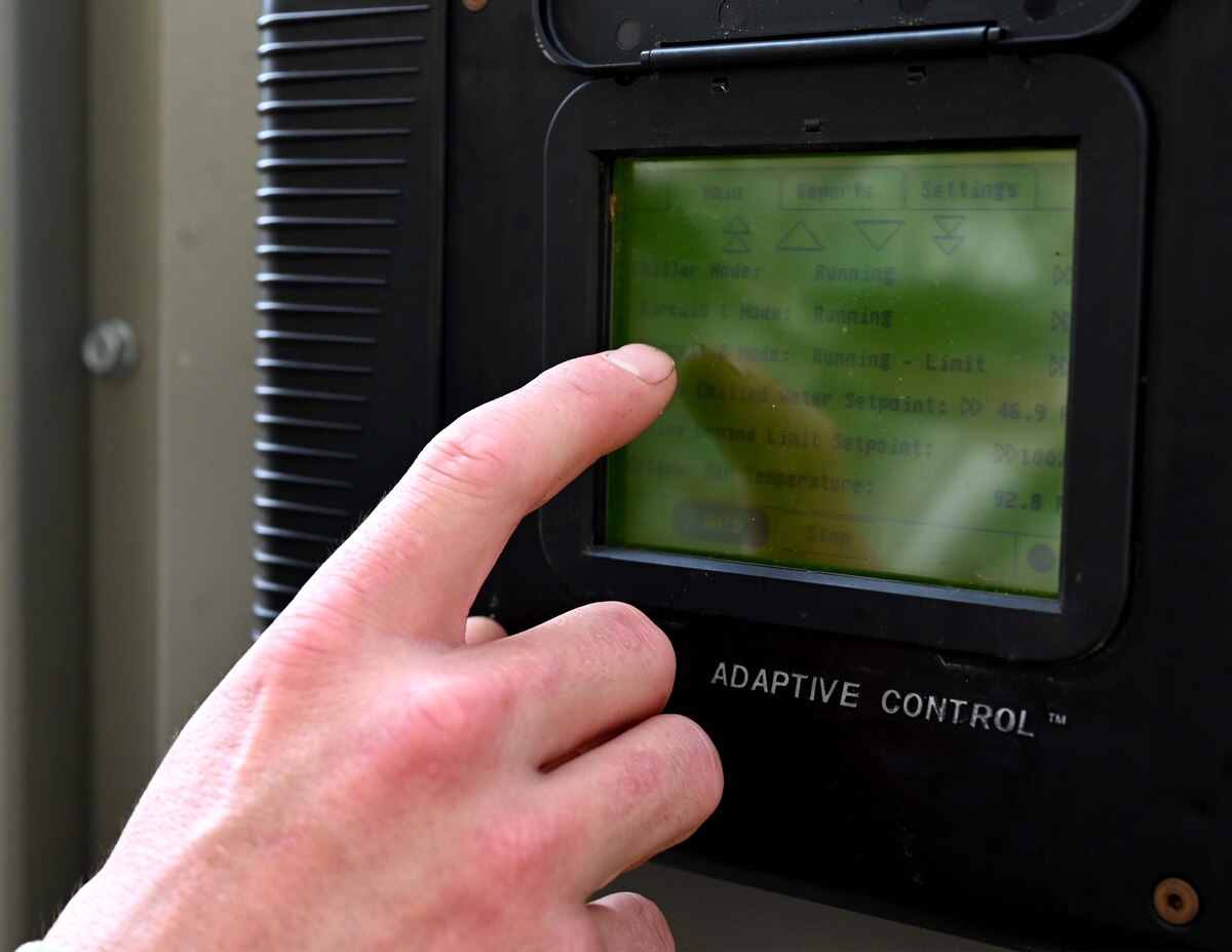 a man touches a control panel