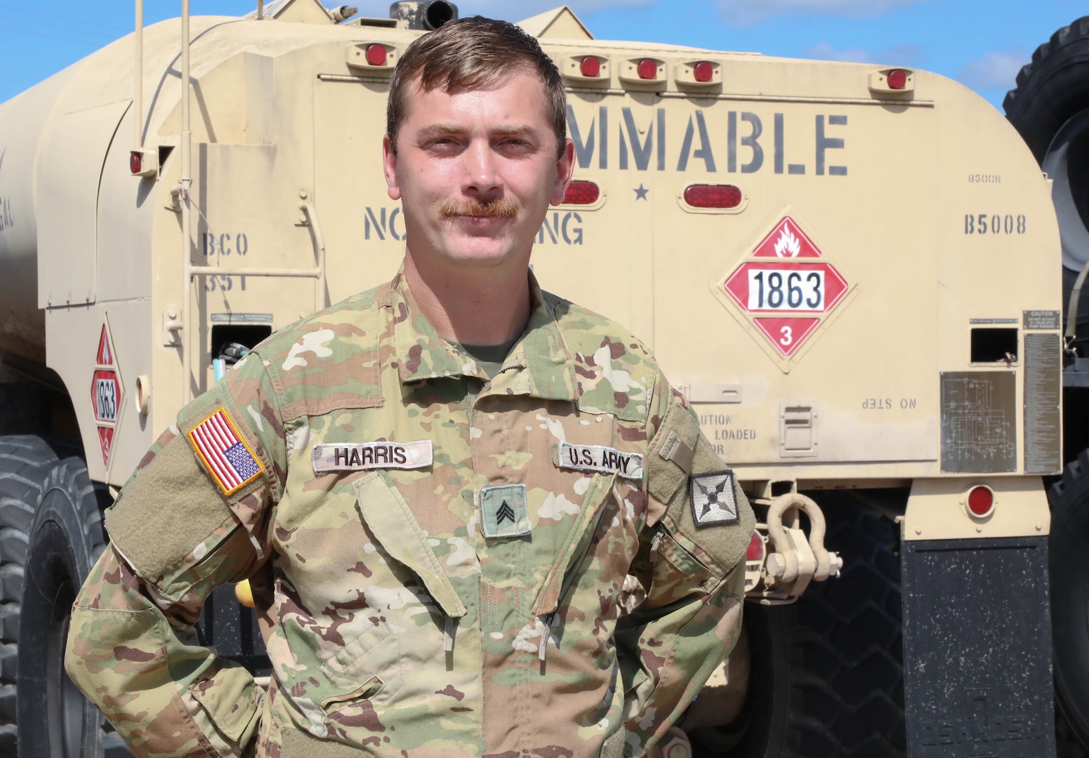 Army Sgt. William ‘Cecil’ Harris, a fuel Supply specialist with Detachment 1, Carlie Co. 2-238th Aviation- ‘Wildcat DUSTOFF’ poses for photo in front of his HEMMTT fuel truck which is capable of holding 2,500 gallons of fuel, which he used to help fuel the flood response mission in Eastern Kentucky.