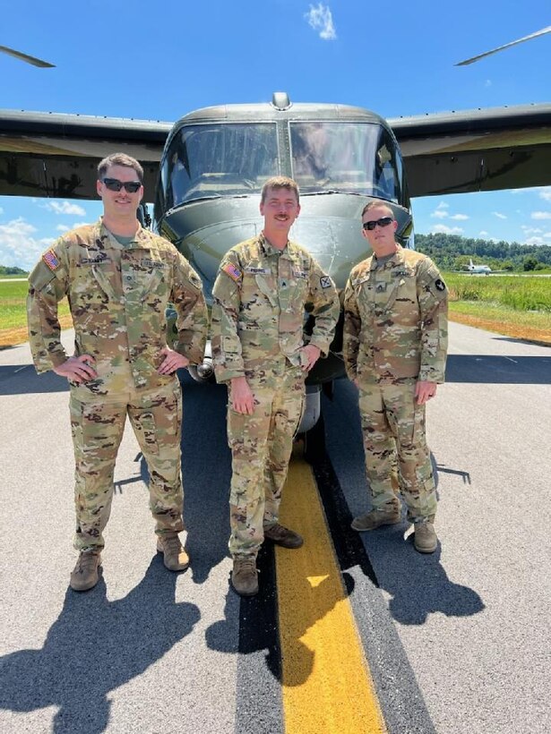 Army Sgt. William ‘Cecil’ Harris, a fuel Supply specialist with Detachment 1, Carlie Co. 2-238th Aviation- ‘Wildcat DUSTOFF’ poses for photo in front of one of the Boeing V-22 Osprey that was on ground during the presidents visit to the flooding area in Eastern Kentucky.
