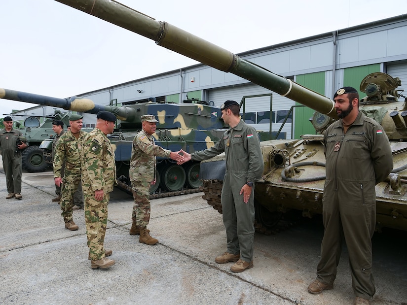 Maj. Gen. John C. Harris Jr., Ohio adjutant general, shakes hands with Hungarian Defence Forces soldiers during an infantry brigade presentation and showcase event June 9, 2022, in Tata, Hungary.