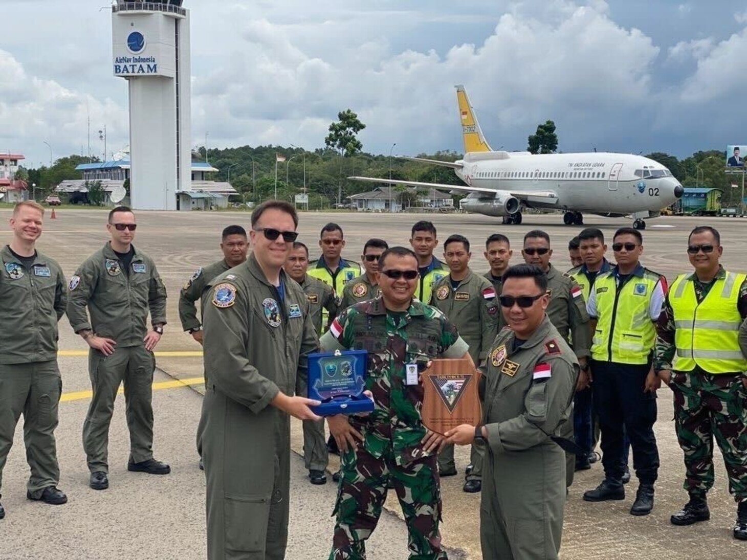 Lt. Bradley Bailey, a naval flight officer from Patrol Squadron (VP) 5, exchanges a gift with Maj. Hendro Sukamdani and Col. Dedy Ilham S. Salam of the Indonesian National Armed Forces, during Exercise Super Garuda Shield. Super Garuda Shield, a part of Operation Pathways and a longstanding annual, bilateral military exercise conducted between the U.S. military, Indonesia National Armed Forces, has now expanded to a multinational exercise encompassing 14 Nations. This exercise reinforces the U.S. commitments to our allies, and other regional partners reinforcing joint readiness, and the interoperability to fight and win together.