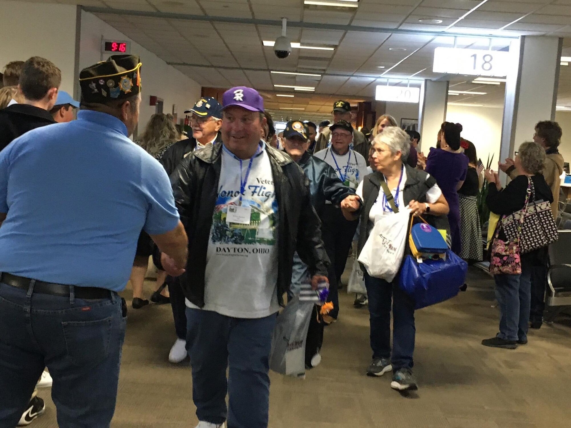 Veterans with Honor Flight Dayton are welcomed home by military members and civilians as they return from Washington.