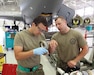 Airman 1st Class Michael Ritter applies lubricant to an O-ring while Staff Sgt. Joshua Fye observes his work at Selfridge Air National Guard Base, Michigan, Aug. 14, 2022