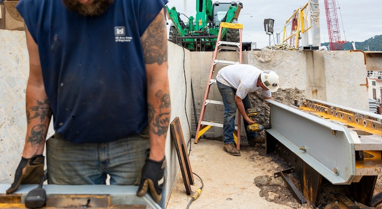 Crewmembers with the U.S. Army Corps of Engineers Medium Capacity Fleet perform repairs at the New Cumberland Locks and Dam on the Ohio River in Moraine, Ohio.