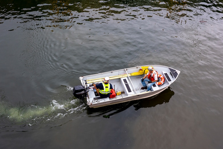 Crewmembers with the U.S. Army Corps of Engineers Medium Capacity Fleet perform repairs at the New Cumberland Locks and Dam on the Ohio River in Moraine, Ohio.
