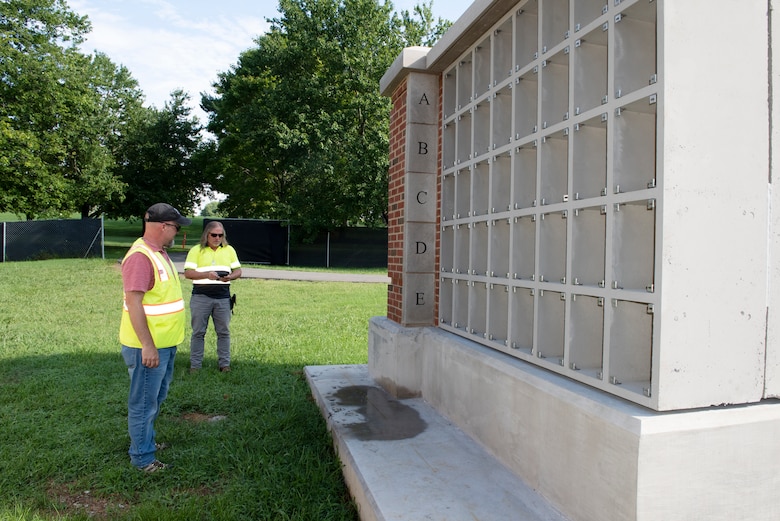 Nathan Alford (Left), engineer technician and construction representative in the Nashville District’s Eastern Tennessee Resident Office in Knoxville; and Will Mullins, project superintendent for Valiant Construction; observe a mockup of a columbarium unit at Mountain Home National Cemetery in Johnson City, Tennessee, Aug. 10, 2022. (USACE Photo by Lee Roberts)