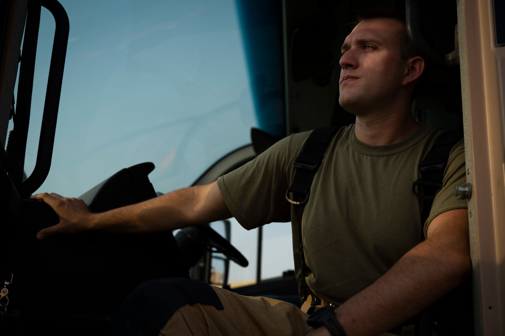 U.S. Air Force Staff Sgt. Nicholas Tafanelli, 386th Expeditionary Civil Engineer Squadron fire protection, surveys the flightline at Ali Al Salem Air Base, Kuwait, August 2, 2022. Tafanelli says one of the things that fills him up at the end of the day is the camaraderie and brotherhood in the squadron, “I gained another family when I joined the fire service, they did everything they could to look after me.” Tafanelli was recently recognized at the United Service Organizations Service Member of the Year award for responding to 318 emergencies, including 61 fires and 128 motor vehicle accidents as a firefighter in Topeka, Kansas. (U.S. Air Force photo by Staff Sgt. Dalton Williams)