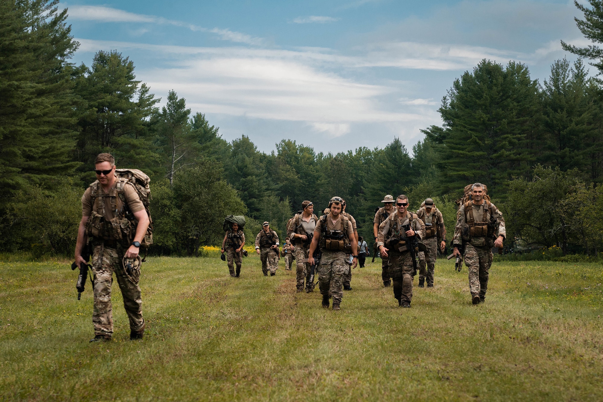 Airmen assigned to the New York Air National Guard’s 274th Air Support Operations Squadron based in Syracuse, part of the 107th Attack Wing, hike to a designated landing zone during a tactical air control party (TACP) training procedure in Upstate N.Y., Aug. 6, 2022.