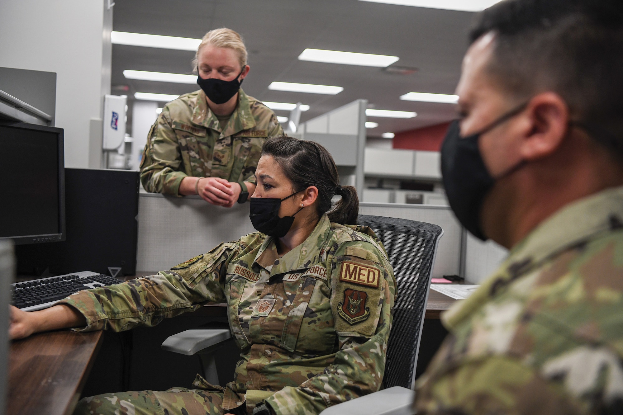 (top) Staff Sgt. Sydney Whiteis, 934th Security Forces Squadron installation patrol, provides feedback to Master Sgt. Cynthia Russold, 908th Aeromedical Evacuation Squadron superintendent, flight operations medical clinic, and Master Sgt. Jimmy Montalvo, 445th Aeromedical Staging Squadron, on the stress inoculation scenario the two built July 28, 2022, at Wright-Patterson Air Force Base, Ohio.