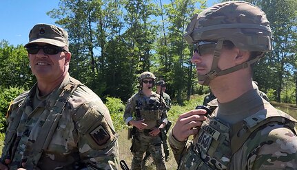 Sgt. 1st Class Ron Hesson, Army National Group Operations Group Wolf Fire Support Team Senior Observer, Coach/ Trainer, observes Soldiers from 134th Field Artillery Regiment, 37th Infantry Brigade Combat Team during a call for fire mission during Northern Strike 2022 on August 9, 2022 at Camp Grayling, Michigan.