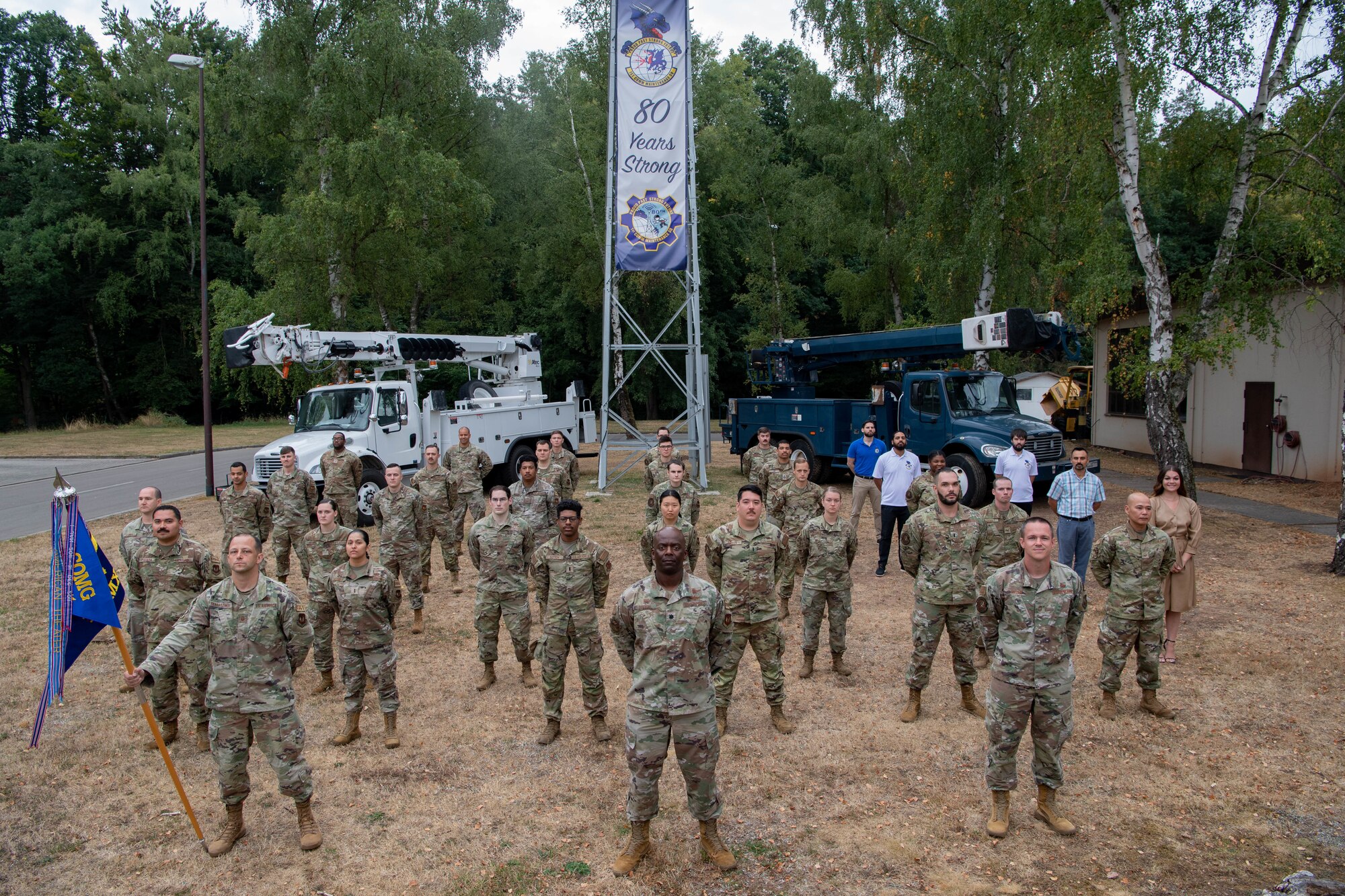 U.S. Air Force Airmen assigned to the 1st Communications Maintenance Squadron stand in a formation at Kapaun Air Station, Germany, Aug. 17, 2022.