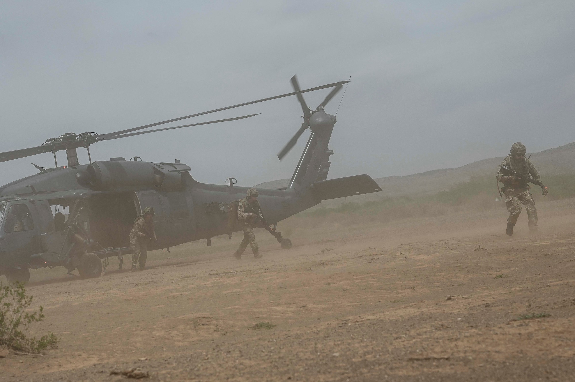 Pictured above are military members exiting a helicopter.