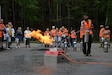 Florian Krause, distribution and transportation safety representative at the U.S. Army Medical Materiel Center-Europe, shows off his skills with the practice fire extinguisher exercise provided by the Rhienland-Pfalz Garrison Fire Department.