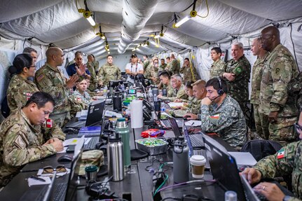 Generals from the U.S. Army and Air force and Brazilian army receive a brief at the Multinational Forces South headquarters at Joint Base San Antonio-Fort Sam Houston during PANAMAX 2022, August 8, 2022.