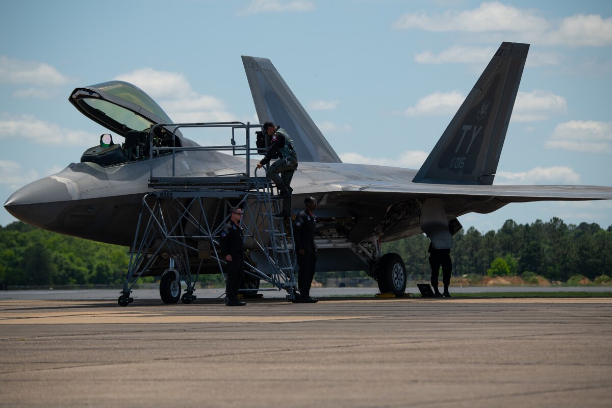U.S. Air Force Maj. Joshua ‘Cabo’ Gunderson, F-22 Raptor Demonstration Team commander, climbs down from his aircraft after performing at an air demonstration on Maxwell Air Force Base, Ala., May 13, 2021. The F-22 Demo Team travels to air shows all across the world to showcase the performance and capabilities of the world's premier 5th-generation fighter. (U.S. Air Force photo by Airman 1st Class Jackson Manske)