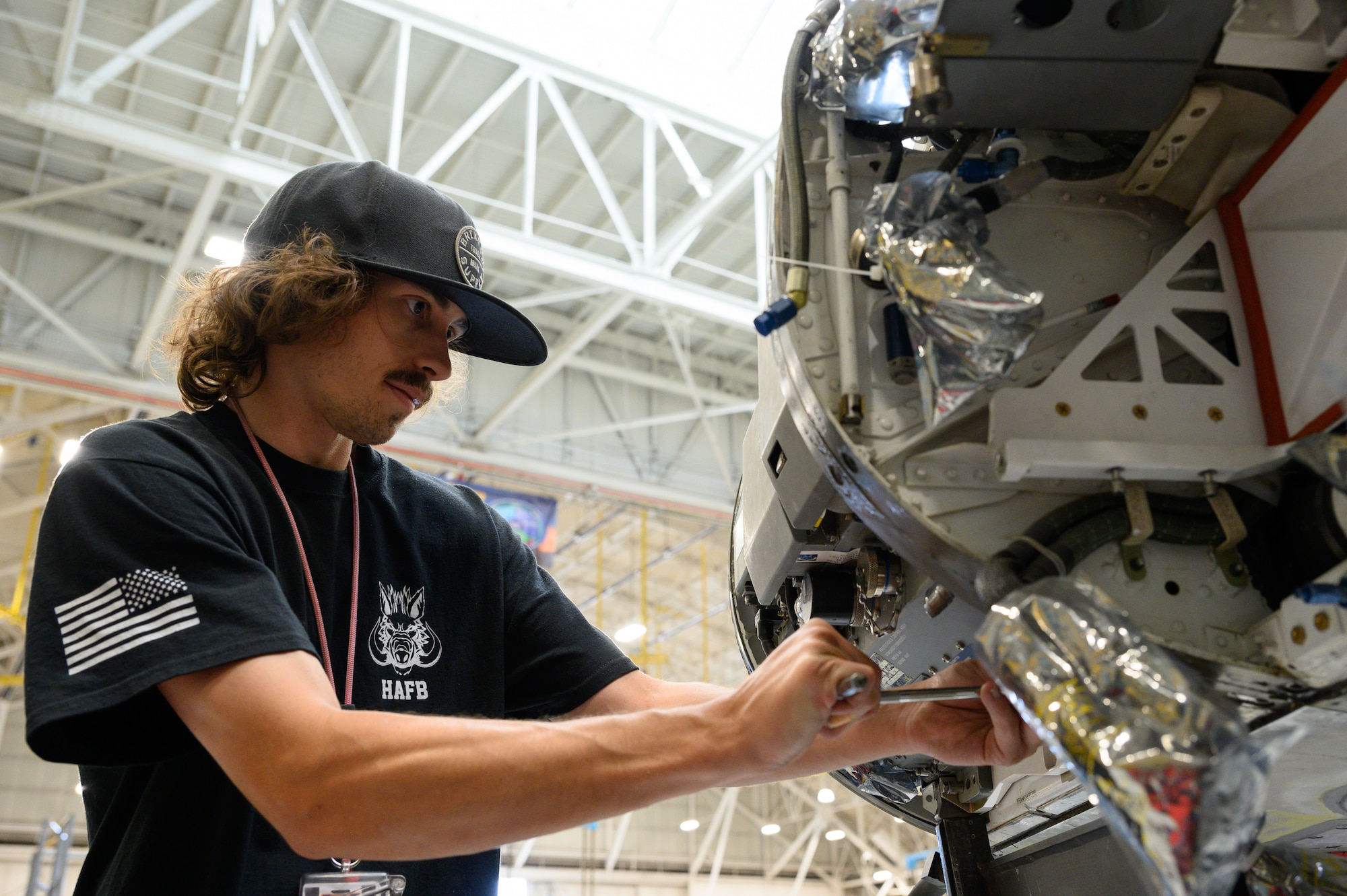 Hunter Ward, 573rd Aircraft Maintenance Unit, installs radar components onto an F-16 Fighting Falcon undergoing a Service Life Extension Program work package at Hill Air Force Base, Utah, Aug. 4, 2022.