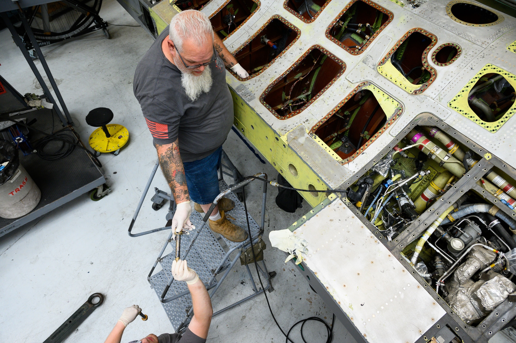 Mike Minchey, 573rd Aircraft Maintenance Squadron, prepares to install a wing onto an F-16 Fighting Falcon undergoing a Service Life Extension Program work package at Hill Air Force Base, Utah, Aug. 4, 2022.