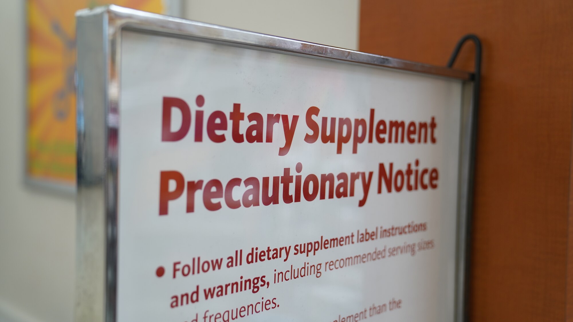 A dietary supplement warning sign is displayed at the Base Exchange on Keesler Air Force Base, Mississippi, Aug. 16, 2022. All stores within the exchange are required to purge their inventories of any products containing banned substances for Department of Defense employees listed on the DoD Prohibited Dietary Supplement Ingredients List.