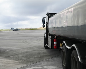An R-11 Refueler is on stand-by to refuel a U.S. Marine Corps F/A-18 Hornet on Andersen Air Force Base, Guam, Aug. 16, 2022. The R-11 Refueler’s fuel tank holds a maximum capacity of 6,000 gallons of fuel that can be issued to an aircraft at a rate of 600 gallons per minute. (U.S. Air Force photo by Airman Spencer Perkins)