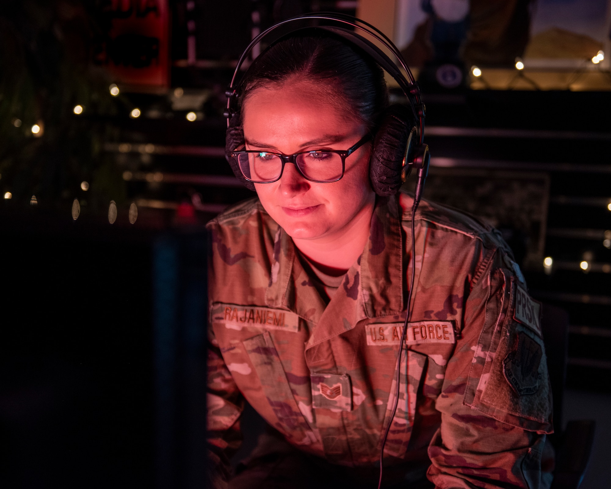 An Air National Guard Airman focuses on her computer screen. (Photo by Timothy Sandland 102nd Intelligence Wing)