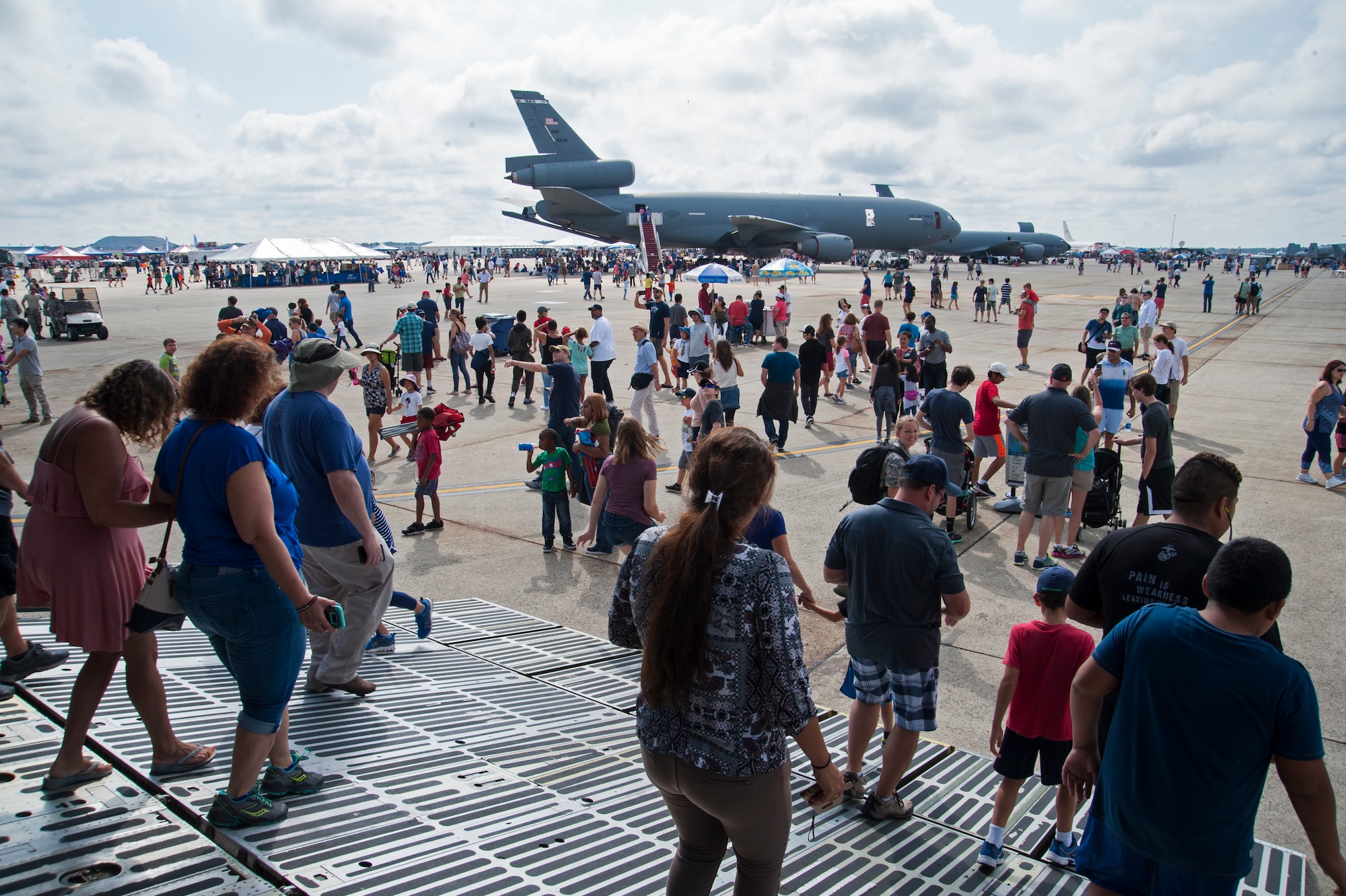 Event attendees walk through the static aircraft displays during the final day of the 2017 Andrews Air Show, Sept. 17, 2017, at Joint Base Andrews, Md.