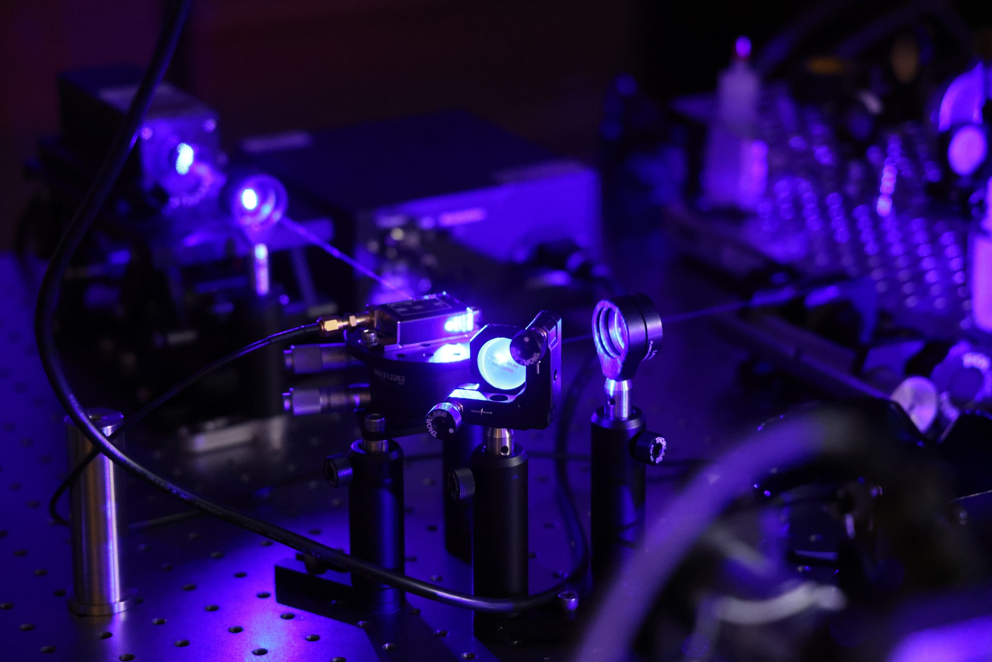 Scientists experiment with phonons at room temperature in the Air Force Research Laboratory’s Quantum Photonics Laboratory, part of AFRL’s Materials and Manufacturing Directorate, Wright-Patterson Air Force Base, Ohio. (U.S. Air Force photo / Micah Hung)
