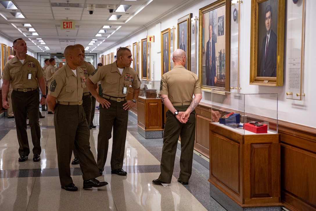 Enlisted leaders from across the U.S. Marine Corps tour the Pentagon during the Sergeant Major of the Marine Corps Symposium in Arlington, Virginia, Aug. 9, 2022. The symposium is designed to provide an educational summit for sergeants major and master gunnery sergeants serving at a general officer command and Navy senior enlisted advisors serving at the Marine Forces level on important and emerging topics in the Marine Corps. The symposium provides a platform for the attendees and presenters to share insights and experiences, which is a key tool for shaping the future of the Marine Corps. (Marine Corps photo by Sgt. Karis Mattingly)