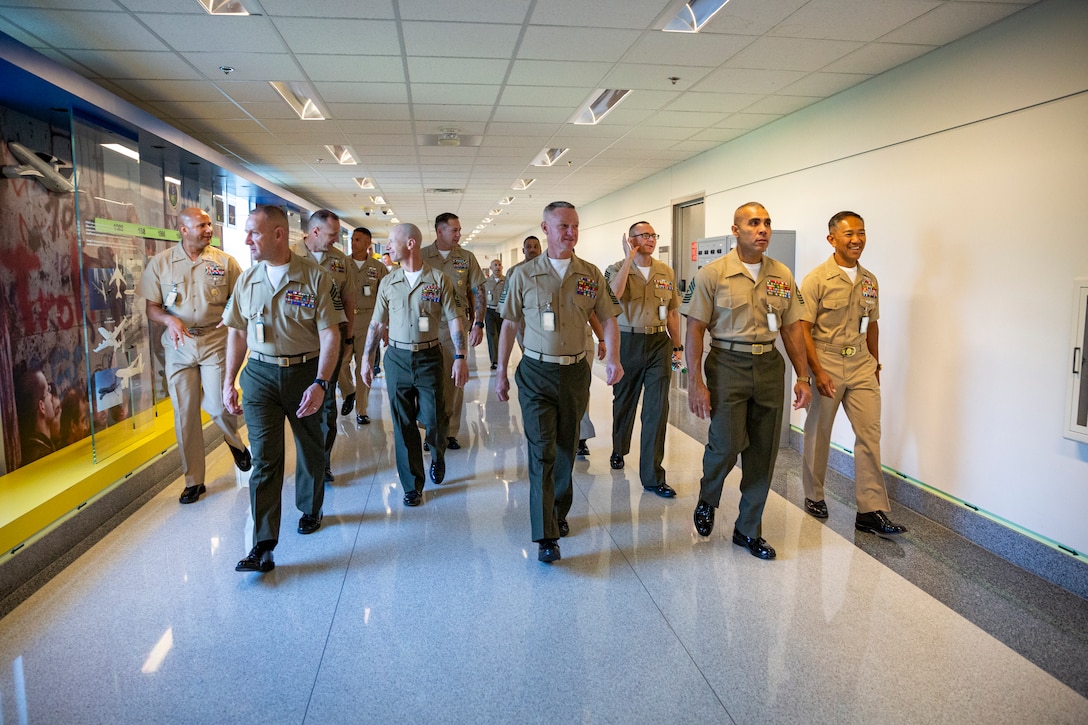 Enlisted leaders from across the U.S. Marine Corps tour the Pentagon during the Sergeant Major of the Marine Corps Symposium in Arlington, Virginia, Aug. 9, 2022. The symposium is designed to provide an educational summit for sergeants major and master gunnery sergeants serving at a general officer command and Navy senior enlisted advisors serving at the Marine Forces level on important and emerging topics in the Marine Corps. The symposium provides a platform for the attendees and presenters to share insights and experiences, which is a key tool for shaping the future of the Marine Corps. (Marine Corps photo by Sgt. Karis Mattingly)