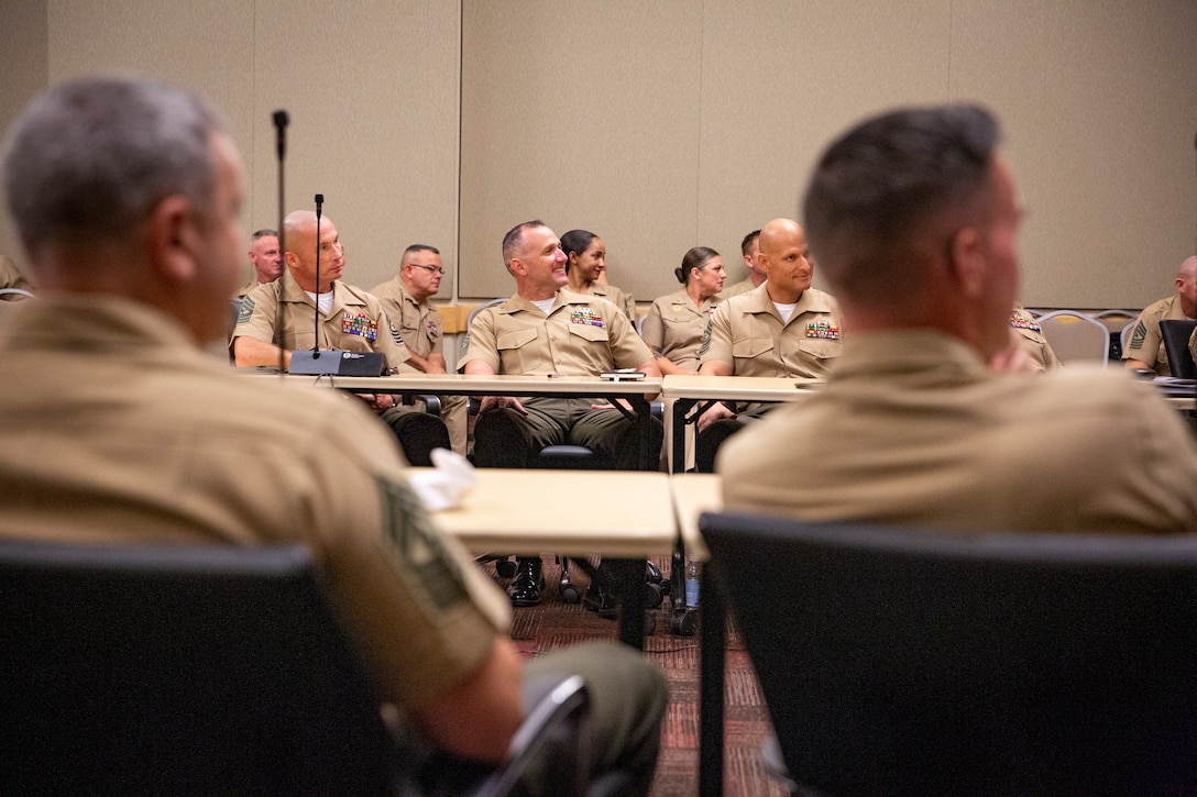 Enlisted leaders from across the U.S. Marine Corps listen to Gen. Eric M. Smith, assistant commandant of the Marine Corps, as he addresses attendees of the Sergeant Major of the Marine Corps Symposium following a tour at the Pentagon in Arlington, Virginia, Aug. 9, 2022. The Symposium is designed to provide an educational summit for sergeants major and master gunnery sergeants serving at a general officer command and Navy senior enlisted advisors serving at the Marine Forces level on important and emerging topics in the Marine Corps. The symposium provides a platform for the attendees and presenters to share insights and experiences, which is a key tool for shaping the future of the Marine Corps. (Marine Corps photo by Sgt. Karis Mattingly)