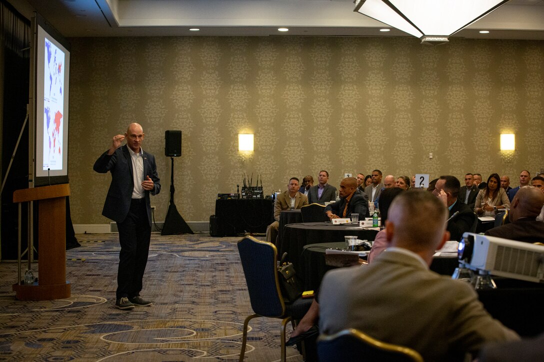 Sgt. Maj. Troy E. Black, Sergeant Major of the Marine Corps, delivers a presentation during the Sergeant Major of the Marine Corps Symposium at the Westfields Marriott in Chantilly, Virginia, Aug. 11, 2022. The Symposium is designed to provide an educational summit for sergeants major and master gunnery sergeants serving at a general officer command and Navy senior enlisted advisors serving at the Marine Forces level on important and emerging topics in the Marine Corps. The symposium provides a platform for the attendees and presenters to share insights and experiences, which is a key tool for shaping the future of the Marine Corps. (Marine Corps photo by Sgt. Karis Mattingly)