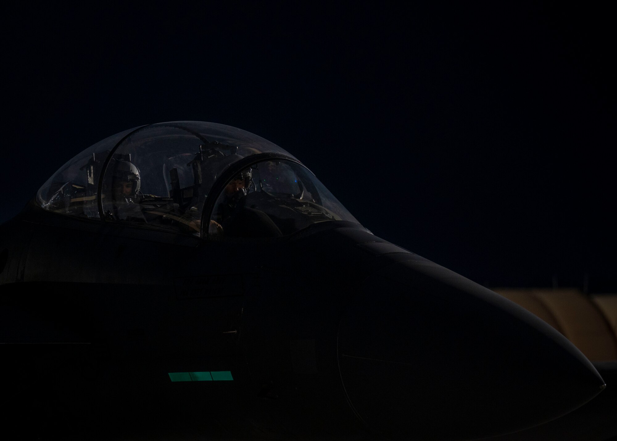 A pilot and weapons system officer, both assigned to the 334th Fighter Generation Squadron, prepare for takeoff at Seymour Johnson Air Force Base, North Carolina, July 28, 2022.
