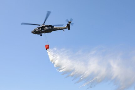 Virginia National Guard Soldiers assigned to 2nd Battalion, 224th Aviation Regiment, 29th Infantry Division conduct helicopter bucket aerial firefighting training near Gjilan, Kosovo, June 2, 2022.