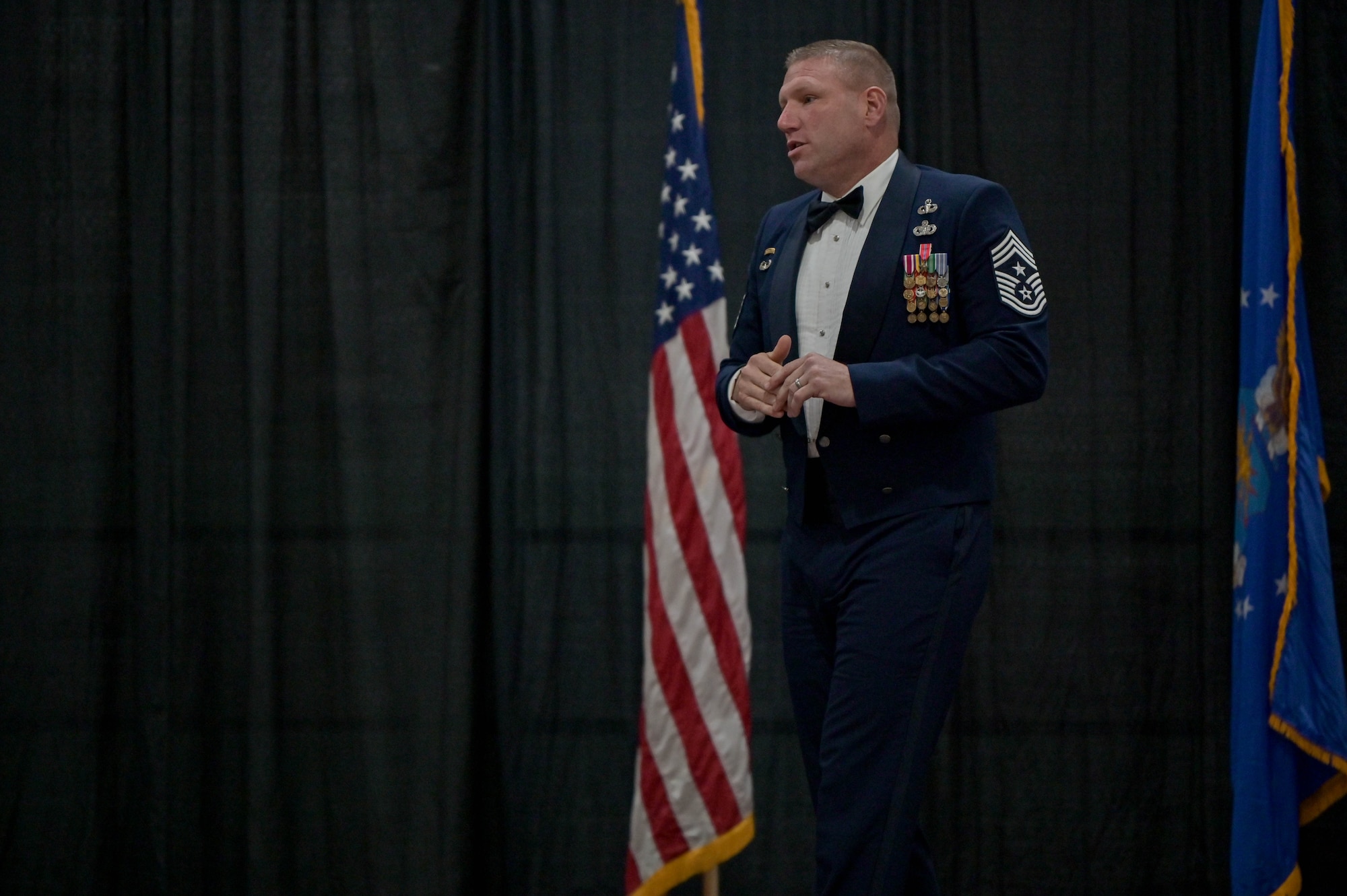 U.S. Air Force Chief Master Sgt. Justin Geers, 23rd Wing command chief, gives a speech to a group of 2022 senior non-commissioned officer inductees during the SNCO induction ceremony at the Rainwater Conference Center, Valdosta, Georgia, Aug. 12, 2022. The inductees have shown their strength and perseverance, and the U.S. Air Force has put their trust in these experienced and skilled Airmen, allowing them to progress to the next level. (U.S. Air Force photo by Senior Airman Rebeckah Medeiros)