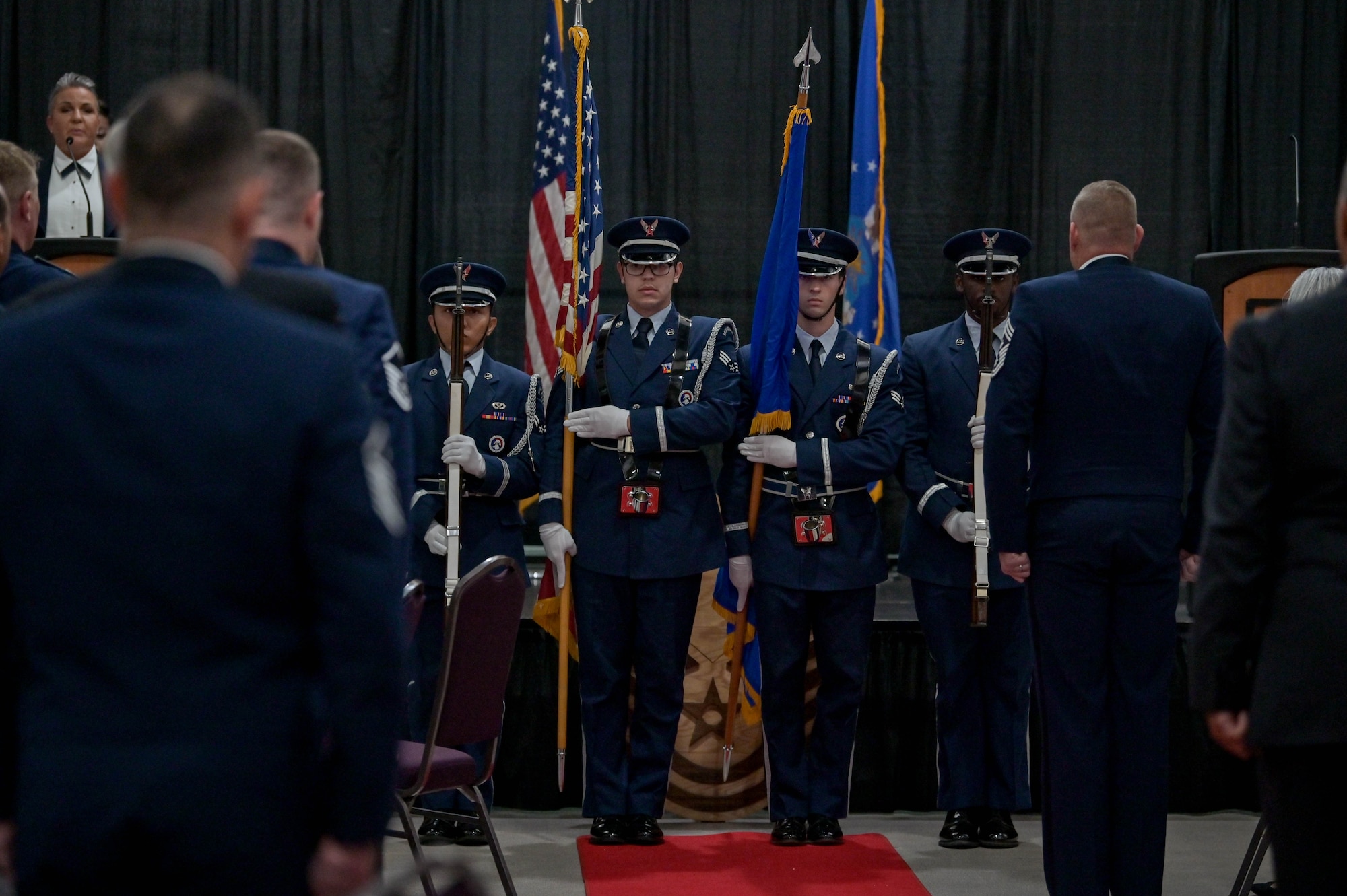 U.S. Air Force Airmen assigned to the 23rd Force Support Squadron honor guard, present the colors during the National Anthem before the senior non-commissioned officer induction ceremony at the Rainwater Conference Center, Valdosta, Georgia, Aug. 12, 2022. The inductees have shown their strength and perseverance, and the U.S. Air Force has put their trust in these experienced and skilled Airmen, allowing them to progress to the next level. (U.S. Air Force photo by Senior Airman Rebeckah Medeiros)