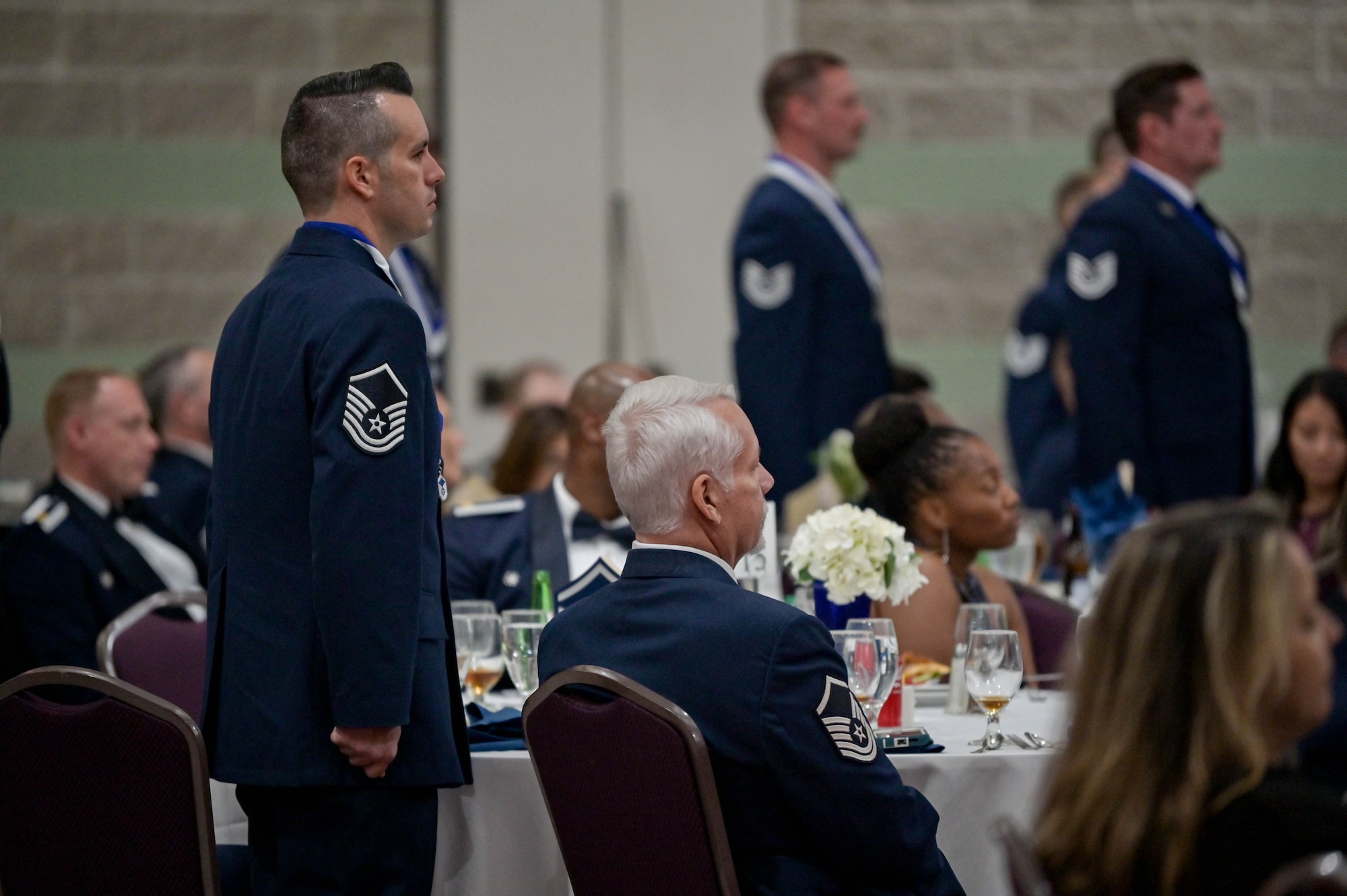 U.S. Air Force Master Sgt. Justin Thornton, 23rd Communications Squadron non-commissioned officer in charge, stands at attention during a SNCO induction ceremony at the Rainwater Conference Center, Valdosta, Georgia, Aug. 12, 2022. All SNCO inductees stood at attention while the senior non-commissioned officer oath was read aloud. The inductees have shown their strength and perseverance, and the U.S. Air Force has put their trust in these experienced and skilled Airmen, allowing them to progress to the next level. (U.S. Air Force photo by Senior Airman Rebeckah Medeiros)