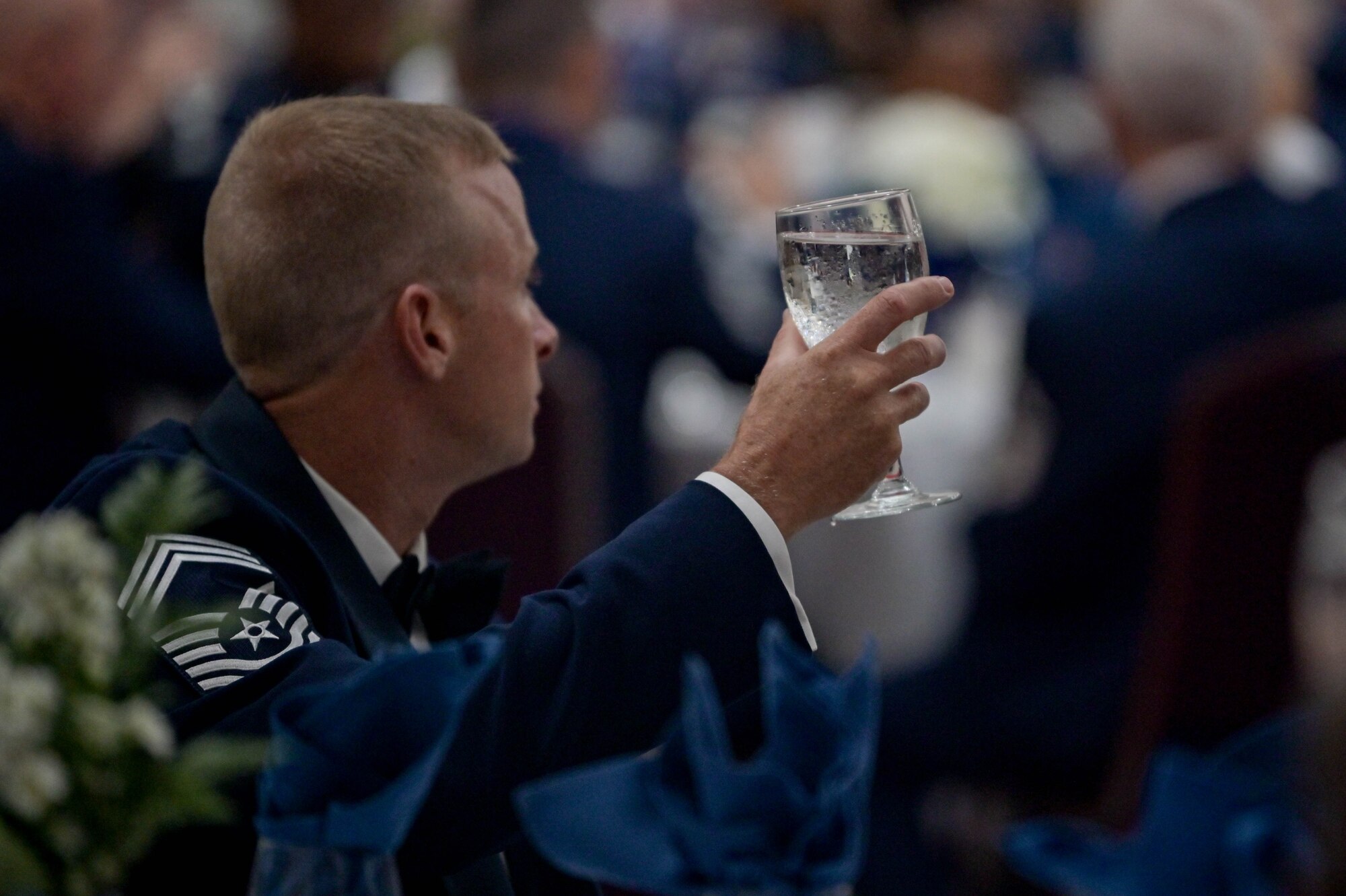 U.S. Air Force Chief Master Sgt. Woodrow Ruff, 23rd Logistics Readiness Squadron senior enlisted leader, raises his glass during a senior non-commissioned officer induction ceremony at the Rainwater Conference Center, Valdosta, Georgia, Aug. 12, 2022. The inductees have shown their strength and perseverance, and the U.S. Air Force has put their trust in these experienced and skilled Airmen, allowing them to progress to the next level. (U.S. Air Force photo by Senior Airman Rebeckah Medeiros)