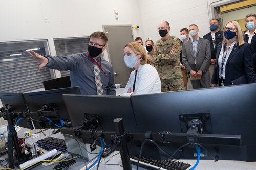Air Force Research Laboratory Program Manager and UES, Inc. Contractor Braden Childers, left, discusses thermal materials testing inside the control room of AFRL’s Laser-Hardened Materials Evaluation Laboratory with Deputy Secretary of Defense Dr. Kathleen H. Hicks, who visited Wright-Patterson Air Force Base, Aug. 17, 2022. Gen. Duke Richardson, center, commander of Air Force Materiel Command, watches the demonstration with Dr. Kevin Geiss, director of Science and Technology Futures, Office of the Under Secretary of Defense for Research and Engineering. (Department of Defense photo / Lisa Ferdinando)