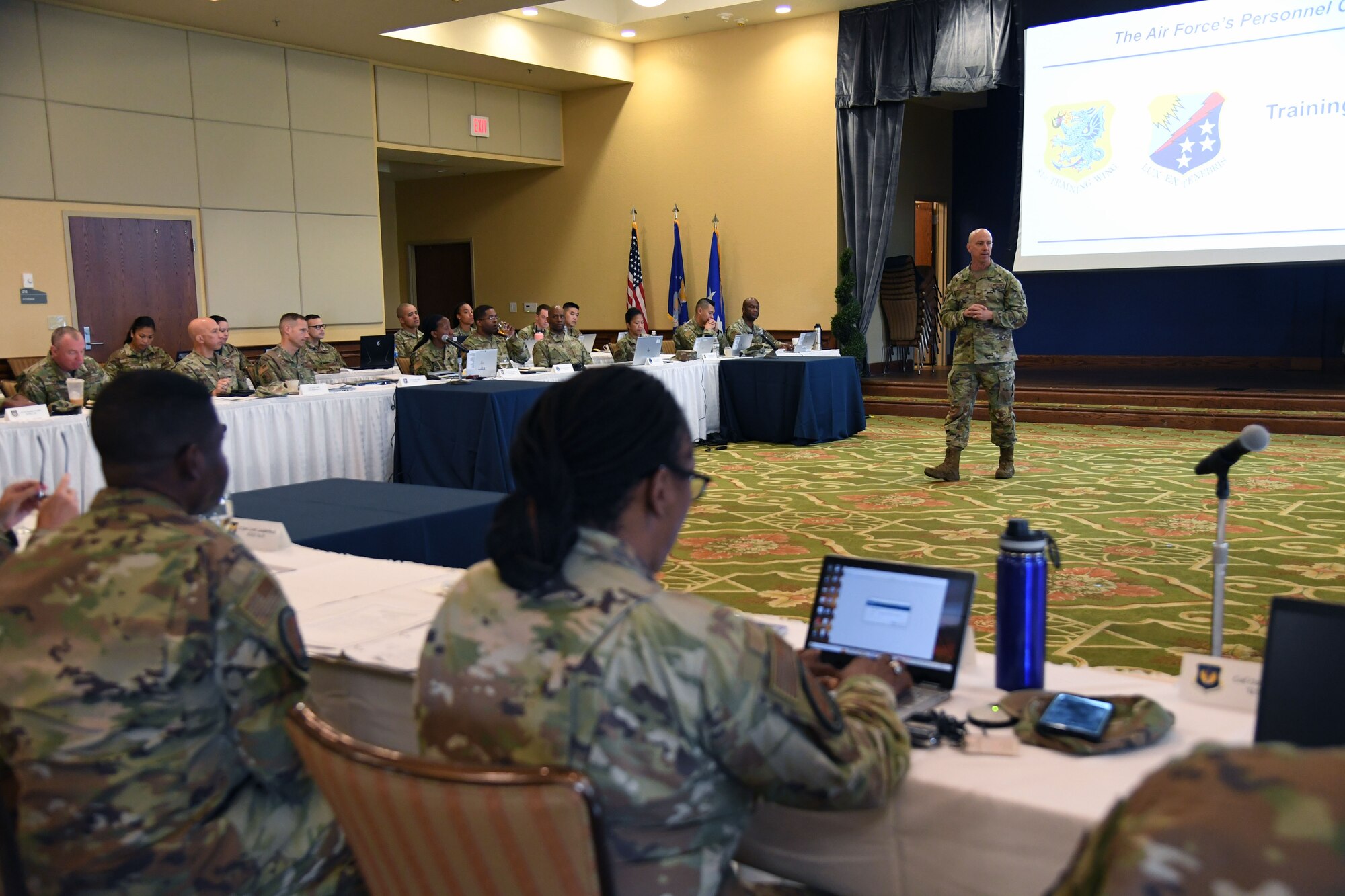 U.S. Air Force Col. William Hunter, 81st Training Wing commander, delivers remarks during the Cyberspace Operations Officer Development Team Summit in the Bay Breeze Event Center at Keesler Air Force Base, Mississippi, August 15, 2022. Lt. Gen. Leah Lauderback, Deputy Chief of Staff for Intelligence, Surveillance, Reconnaissance and Cyber Effects Operations, Headquarters U.S. Air Force, the Pentagon, Arlington, Virginia, and her team attended the summit and also toured the 333rd Training Squadron and 336th Training Squadron to meet and greet squadron personnel, understand the squadron's mission and be briefed on new innovations. (U.S. Air Force photo by Kemberly Groue)