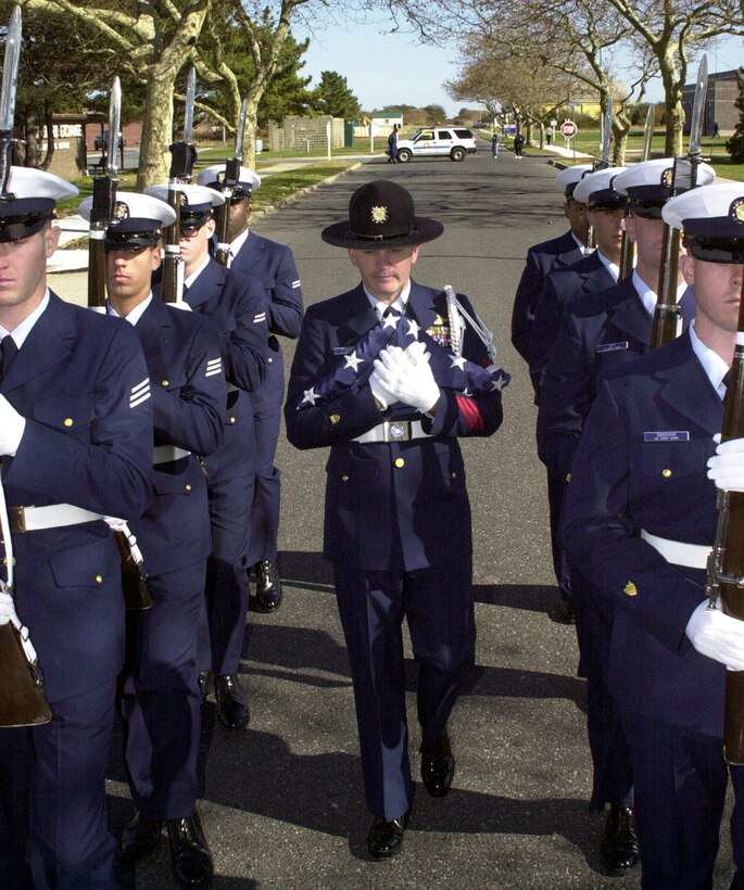 CAPE MAY, NJ (Nov. 10, 2004)--Yeoman First Class Mike Franson leads a recruit drill team.  Franson and his recruits provided an honor guard to escort the flag to its next scheduled stop where it honored the mission and people of recruit Training Center Cape May.  USCG photo by PA3 John Edwards