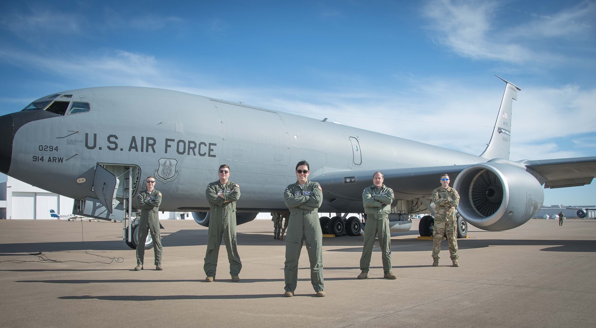 Aircrew and maintenance pose in front of a KC-135 Stratotanker aircraft.